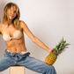 Woman with pineapple wearing Perkies sticky bra